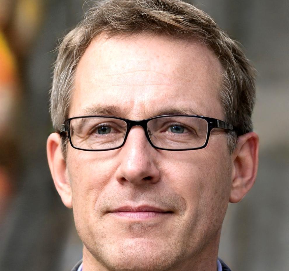 Experienced tour guide instructor reviewing training materials