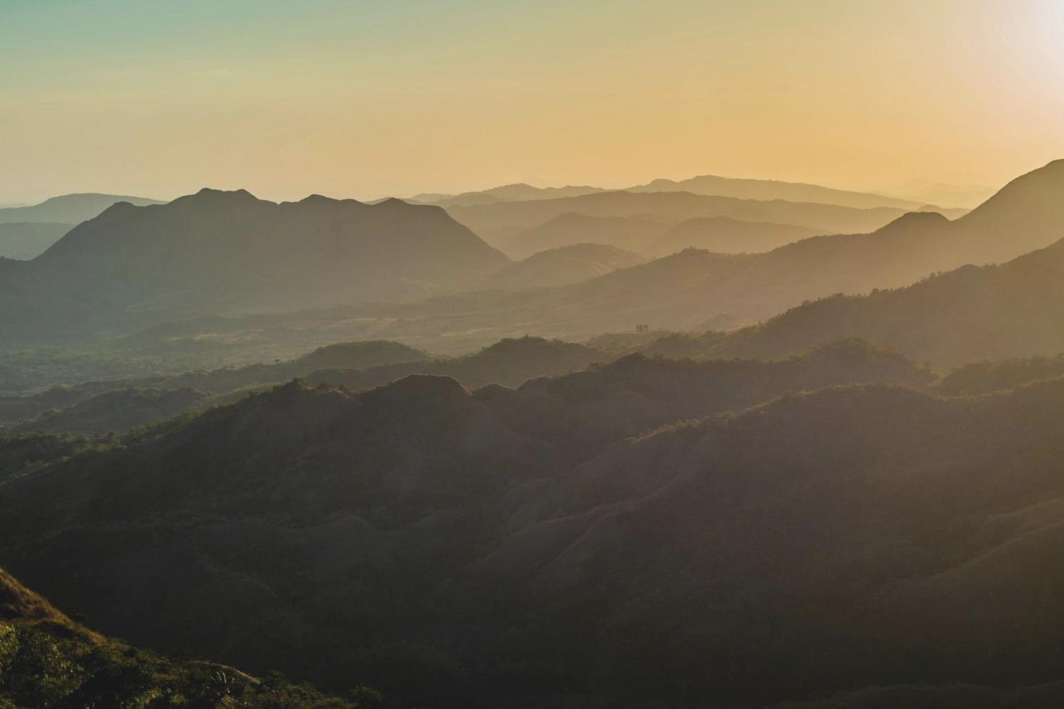Guide reviewing tour notes and reference materials during preparation